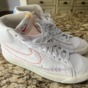 Nike White High-Top Sneakers with Orange and Purple Stitching